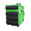 Kocioł AgroWarmer 250 KW na słomę i biomasę. Zielony kocioł z czarnymi drzwiczkami.